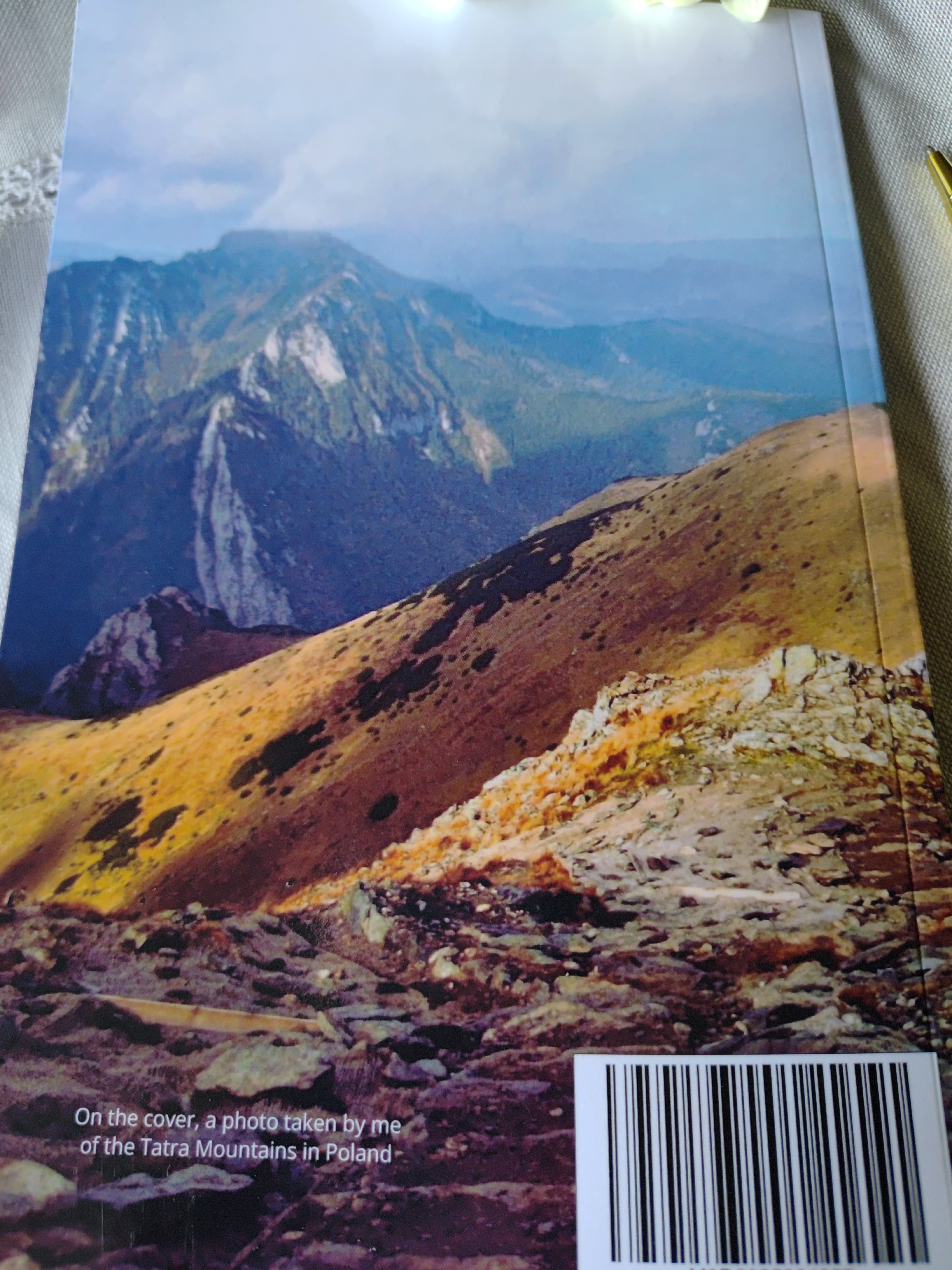 Back cover of 6x9 glossy journal with mountains photo