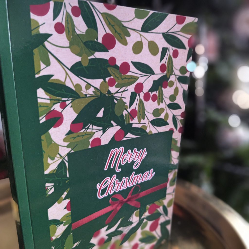 Merry Christmas journal with glossy soft cover, festive botanical Christmas design, 110 lined lined pages